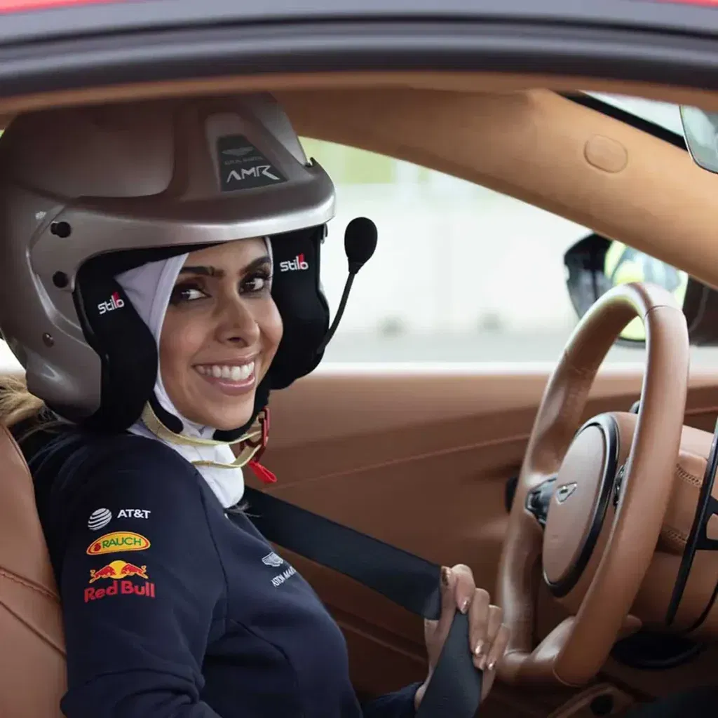 Female drive sits behind the wheel of an Aston Martin